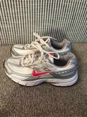 Nike Women's White and Silver Running Shoes with Pink Swoosh